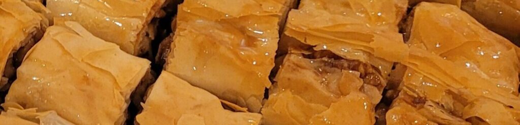 Baklava made with honey, butter, walnuts, lemon juice, cinnamon and filo. No sugar syrup, no oil. No corners cut at all